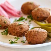 Falafel · Served with lettuce, tomato, parsley, pickles and tahini sauce.