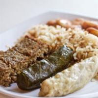 The Sampler · One grape leaf, one cabbage, baked kibbee, rice pilaf, lima beans or green beans.