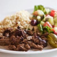 Beef Shawarma · Gluten free. Tender beef marinated overnight, slow cooked on vertical rotisseries, served wi...