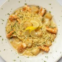 Scampi · shrimp, scallops, lemon garlic butter white wine sauce, capellini.