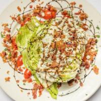 Wedge Salad · iceberg lettuce, gorgonzola. tomato, bacon, blue cheese dressing, balsamic drizzle.