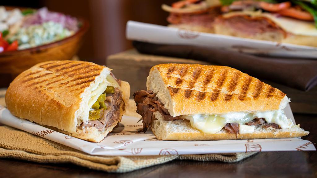 Boxer · Hot roast beef, provolone, hot cherry peppers, horsey sauce, grilled baguette. Grilled.