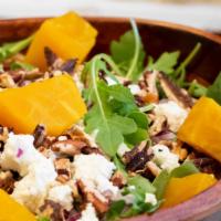 Golden Beet · Arugula, roasted golden beets, goat cheese, roasted pecans, red onion, curry vinaigrette.
Ve...