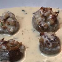 Stuffed Mushrooms · Stuffed with crabmeat, topped with a cream sauce.
