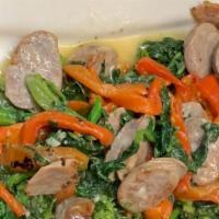 Broccoli Rabe & Roasted Peppers With Sausage · Sauteed in a garlic white wine sauce.
