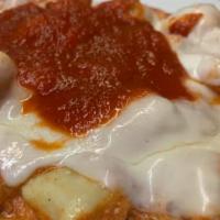 Gnocchi Abbruzi · Fresh gnocchi tossed with tomato sauce and ricotta cheese, topped with melted mozzarella che...