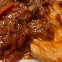 Chicken Cacciatore · Chicken sautéed with mushrooms, green peppers, red peppers, and onions in a marinara sauce o...