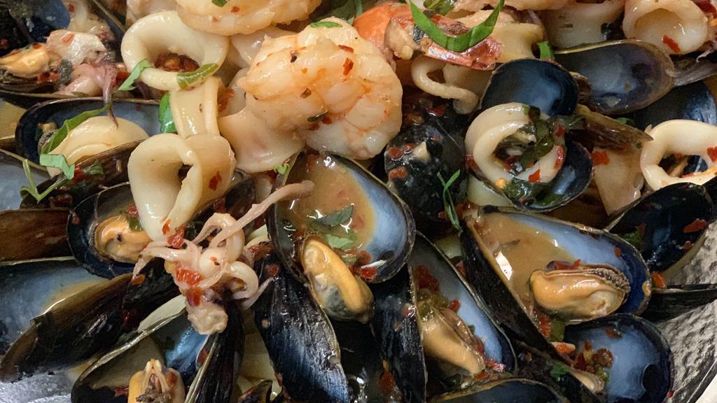 Zuppa Di Pesce · Fresh clams, mussels, calamari and shrimp in a marinara sauce or garlic white wine sauce over pasta.