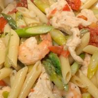 Shrimp, Chicken & Asparagus · Shrimp, strips of chicken, fresh asparagus, sun dried tomatoes, and plum tomatoes sautéed in...