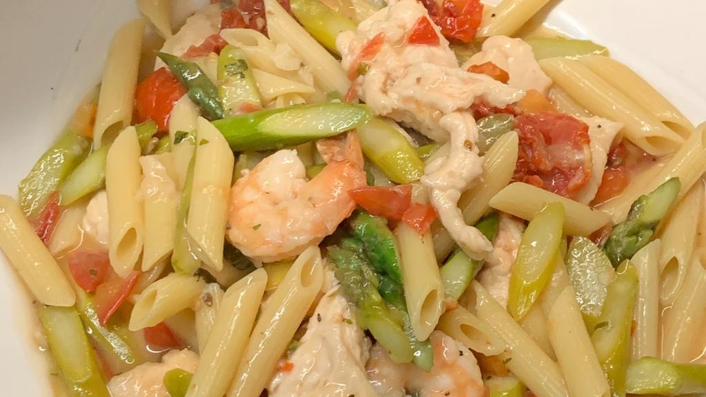 Shrimp, Chicken & Asparagus · Shrimp, strips of chicken, fresh asparagus, sun dried tomatoes, and plum tomatoes sautéed in a garlic white wine sauce over penne.