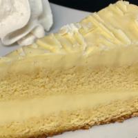 Lemon Mascarpone Cake · Three layers of vanilla cake with lemon mascarpone cream filling topped with white chocolate...