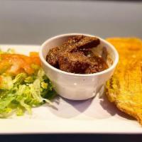 Carne Guisada · Dominican Style chicken stew, green salad, choice of rice & beans or tostones.