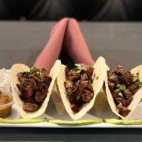 Steak Taco · Traditional Mexican tacos with steak diced cut.