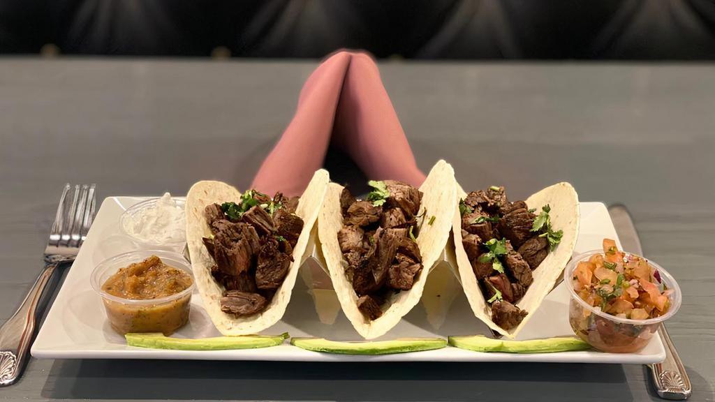 Steak Taco · Traditional Mexican tacos with steak diced cut.