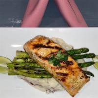 Grilled Salmon · Grilled fillet of salmon, Served with redskin mashed potatoes, and mix vegetables.
