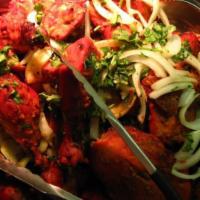 Chicken Tandoori - Full · Chicken Legs and Thigh pieces are marinated overnight in yogurt with herbs and spices and co...