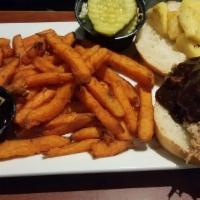Bbq Pulled Pork Sandwich · Tender pulled pork in our homemade Southern comfort BBQ sauce with grilled pineapple on a co...