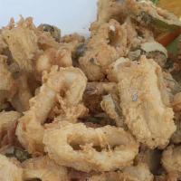 Fried Calamari · Tempura fried calamari tossed with fried jalapenos and a side of citrus aioli sauce or our t...