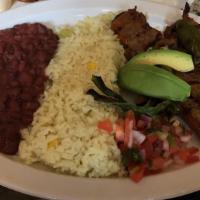 Carne Asada · Grill steak served with rice red beans spring onions, jalapenos salad, avocado, cheese.
