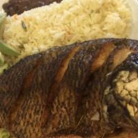 Pescado Frito · Fried fish served with rice,beans and salad.