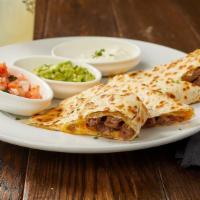 Carne Quesadilla · Flour tortilla filled with steak and cheese, topped with pico de gallo, sour cream, and guac...