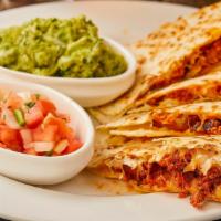 Chorizo Quesadilla · Flour tortilla filled with sausage and cheese. Topped with pico de gallo, sour cream, and gu...