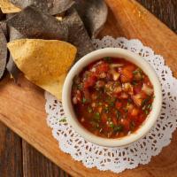 Chips & Salsa · Homemade spicy salsa and tortilla chips.