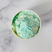 Birthday Cake · Cake batter chunks in vanilla ice cream with colorful candy pieces and waves of blue icing.