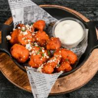 Bangin' Cauliflower Bites · Tossed in buffalo and topped with crumbled blue cheese