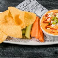 Buffalo Chicken Dip · Chunks of marinated chicken breast in a creamy buffalo cheese sauce layered w/ blue cheese c...