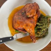 Roasted Half Chicken · Crispy & juicy half-roast chicken topped with a maple bourbon jus, served with sauteed brocc...