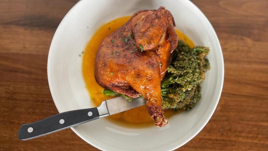 Roasted Half Chicken · Crispy & juicy half-roast chicken topped with a maple bourbon jus, served with sauteed broccolini & mashed potatoes