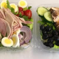 Cobb Salad · Greens, Tomatoes, Cucumbers, Chopped eggs, Red Onions, Ham, Turkey,Blu Cheese Crumbles, Ranc...