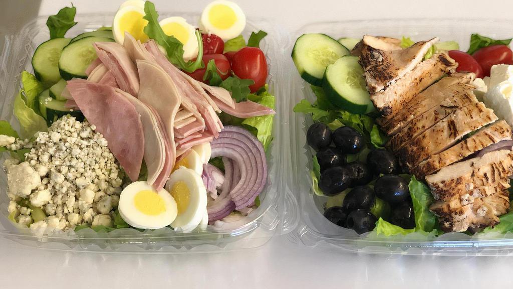 Cobb Salad · Greens, Tomatoes, Cucumbers, Chopped eggs, Red Onions, Ham, Turkey,Blu Cheese Crumbles, Ranch Dressing