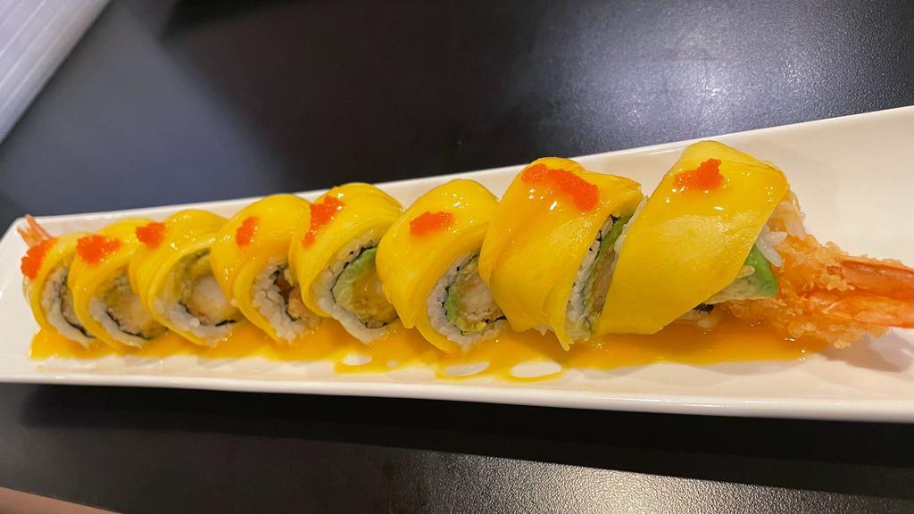 Golden Dragon Roll · Shrimp tempura, avocado inside, topped with mango, tobiko with mango sauce.