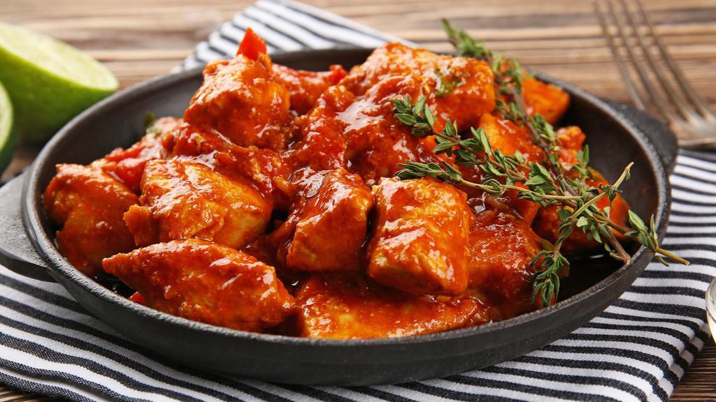 Paneer Tikka Masala · Traditional homemade cottage cheese cubes, cooked in a clay oven with a mixture of green peppers and onions in a rich, creamy gravy.