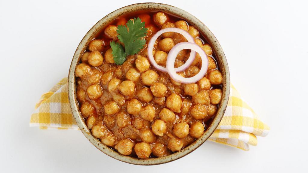 Chana Masala · Traditional chickpeas cooked in a special blend of Indian spices.