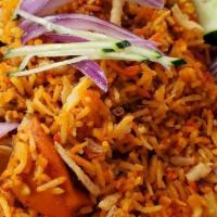 Chicken Tikka Biryani · Marinated chunks of chicken cooked in a clay oven, then mixed with seasoned basmati rice.