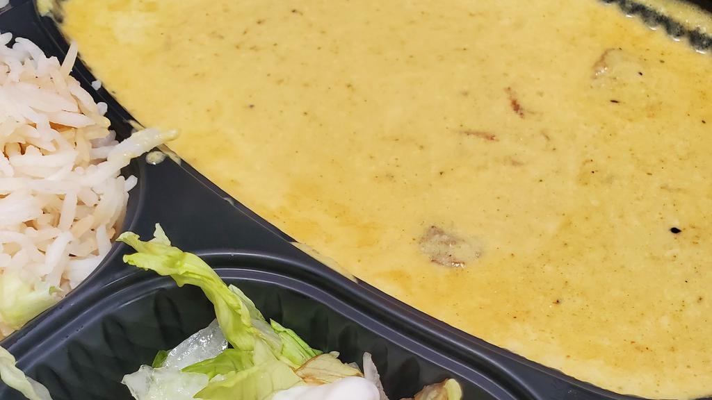 Lamb Korma · Chunks of lamb slowly cooked with onion, special korma, heavy cream sauce. Served with naan, rice and side salad