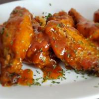 Chicken Wings · Sweet chili, mango habanero, buffalo, lemon pepper, Acadia red