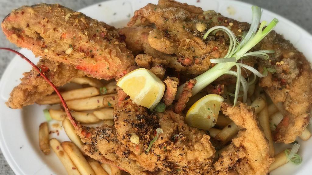 Fried Salt & Pepper Lobster · Golden fried lobster seasoned to perfection, Served on a bed of classic fries