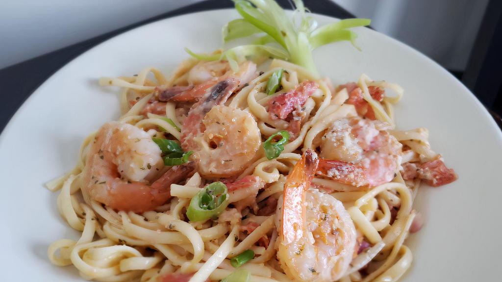 Shrimp Scampi · Sauteed jumbo shrimp, white wine, herbs, scallion, tomatoes, garlic, Served over Linguine