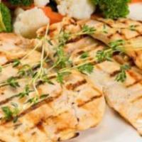 Pechuga Asada · A delicious grilled chicken breast served with white rice and a side salad