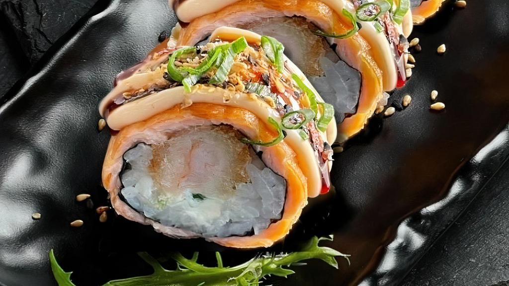 Salmon Grill Roll · 8 pieces. Rice, nori, shrimp tempura, cream cheese, grilled salmon, mayo, sesame, and eel sauce.