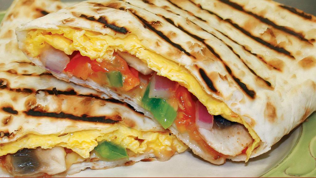 Western Omelet Panini · Egg omelet, mushrooms, green peppers, red onions, tomatoes and cheddar Jack cheese.