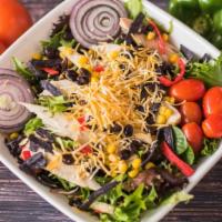 Southwest Chicken · Grilled chicken, onions, corn, black beans, tortilla strips and mixed cheese over spring mix...
