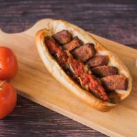 Hot Sausage Parm Sub · Oven-baked with grilled onions, green peppers, marinara, and provolone cheese.