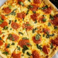Margarita Pizza · White pizza, fresh mozzarella, tomato, fresh basil, and mozzarella.