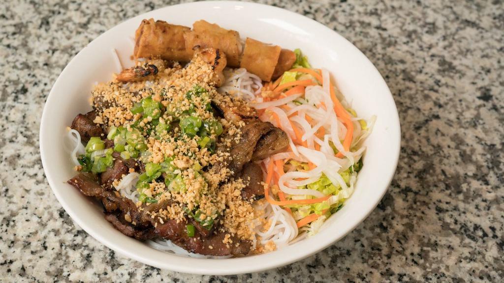 House Special Bun · Pork, shrimp, one spring roll, vermicelli rice noodles, lettuce, mint, scallion oil, peanuts, and pickled daikon, and carrots.