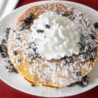 Buttermilk Pancakes · Topped with powdered sugar.